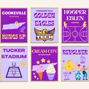 May include: Six purple and gold illustrated posters with various designs. The posters feature a map of Tennessee, a basketball court, a football field, a ice cream cone, a disco ball, and a golden eagle. The posters have gold frames.