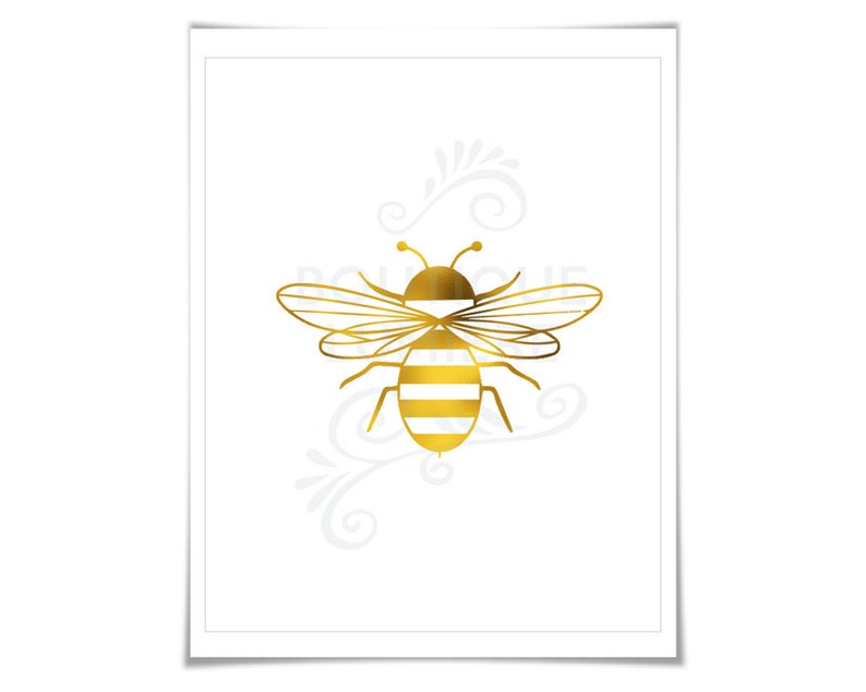 May include: A gold bee with white stripes on its body is on a white background. The bee has a simple design and is a popular motif for home decor.