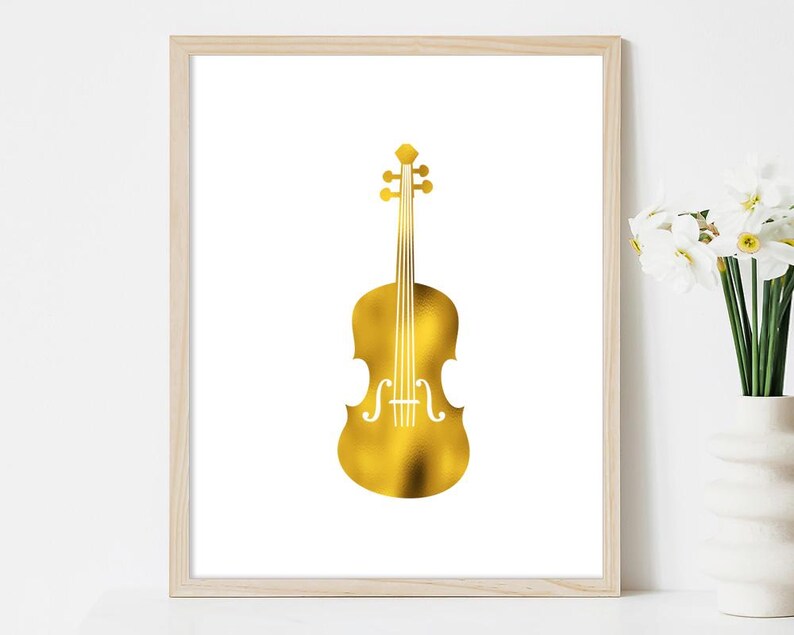 May include: A gold foil print of a violin on a white background. The print is framed in a light wood frame.