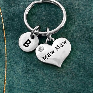 May include: Silver keychain with a heart charm that says "Maw Maw" and a round charm with the letter "B".