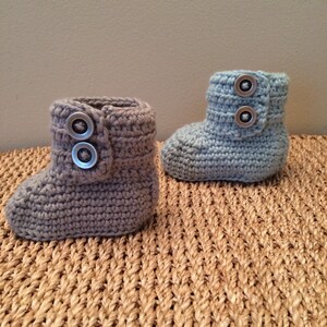 Baby booties with buttons. image 2