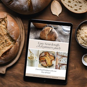 May include: A digital tablet displaying a book cover for "Easy Sourdough: A Beginners Guide". The cover features a white background with a brown title and a collage of sourdough bread images.