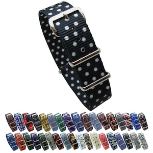 May include: A black and white polka dot watch strap with silver buckle. The strap is made of nylon and is 20mm wide. The strap is shown with a variety of other patterned watch straps.