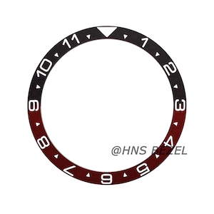 May include: A black and red watch bezel with white numbers and a triangle at the 12 o'clock position. The bezel is marked with the text "@HNS BEZEL".