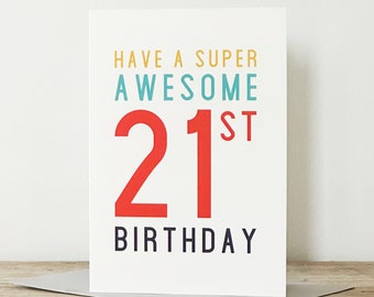 May include: A white card with the text "Have a super awesome 21st birthday" in colorful lettering. The number 21 is in red.