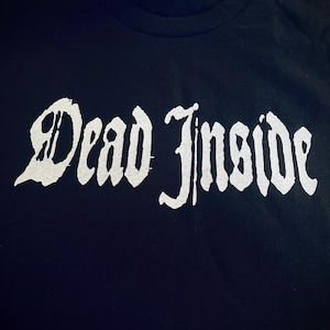 May include: Black t-shirt with a white graphic that says "Dead Inside" in a gothic font.