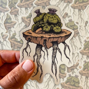 May include: A sticker depicting a floating island with a cactus-like plant. The plant is green with purple details, and the island is brown with roots. The sticker has a detailed, artistic design, suitable for various applications.