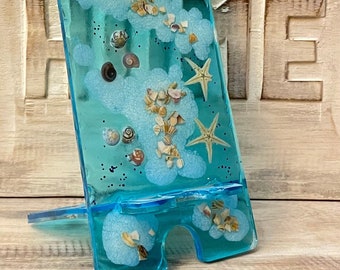 Mobile phone stand, mobile phone holder made of epoxy resin with small starfish and snail shells