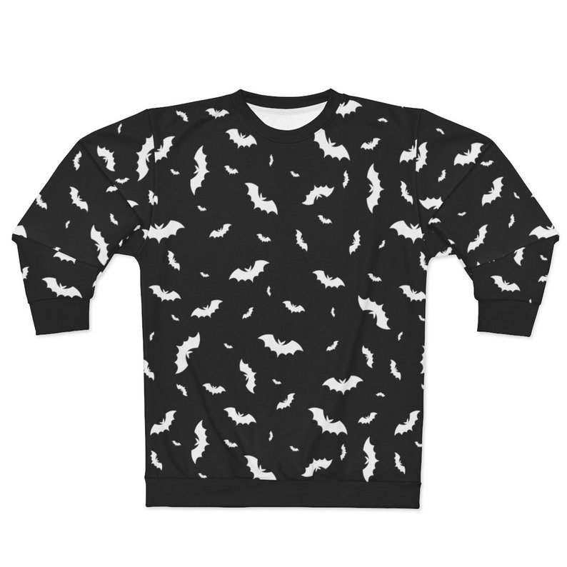 May include: Black sweatshirt with a white bat pattern.