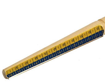 May include: A wooden ring sizer with a gold and blue tape measure. The tape measure has numbers from 2 to 23.