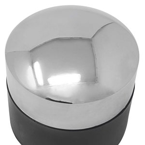 May include: A silver and black bottle stopper with a rounded top.