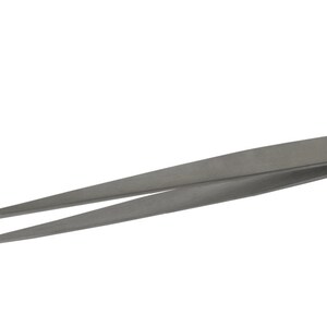 May include: A pair of silver-toned tweezers with a small, round, silver button in the center.