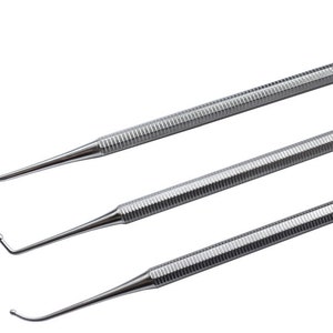 May include: Three silver dental tools with rounded tips. The tools have a textured handle and are used for dental procedures.