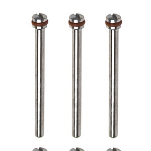 May include: Six silver metal sanding drums with brown rubber bands at the top. The drums are used for sanding and polishing.