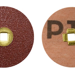 May include: Two round sanding discs, one brown with a gold center hole and the other beige with a gold center hole and the text "P15" printed on it.