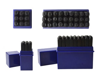 May include: A set of metal letter and number stamps in blue plastic cases. The stamps are arranged in alphabetical and numerical order.