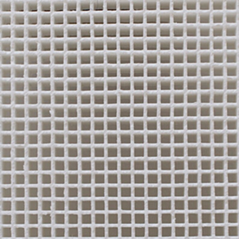 May include: White ceramic tile with a grid pattern of small squares.