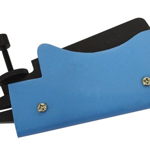 May include: A blue and black tool with a handle and a pair of jaws. The tool has a screw adjustment knob and is used for bending metal.