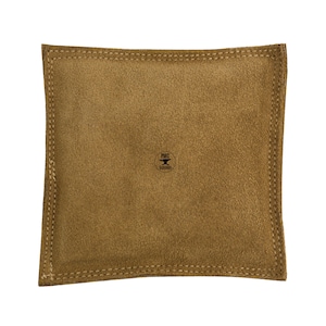 May include: A brown suede pouch with a stitched border and a small black logo that says "PMC Supplies".
