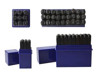 May include: A set of metal letter and number stamps in blue plastic cases. The stamps are arranged in rows and columns, and they are all the same size. The cases are all the same color, and they have a simple design.