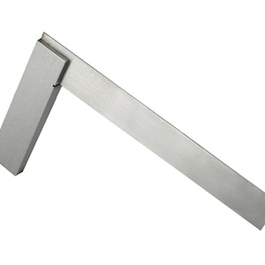 May include: A silver metal try square, a tool used for measuring and marking right angles.