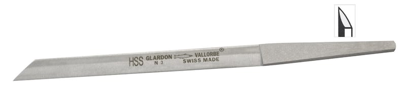 May include: A silver-colored, rectangular file with a beveled edge. The file has the text "HSS GLARDON VALLORBE SWISS MADE" printed on it. A small diagram of the file's profile is in the upper right corner.