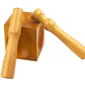 May include: A wooden tool for leather crafting with two wooden mallets. The tool has three round depressions for creating different sized holes in leather.