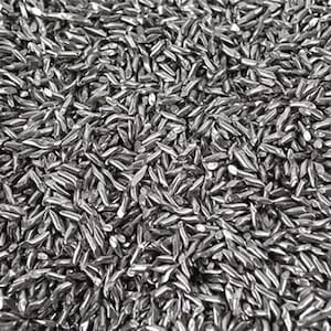 May include: A close-up image of a large quantity of small, silver, metallic, elongated, and pointed objects. The objects are arranged in a random pattern and appear to be made of metal.