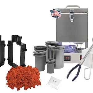May include: A metal melting furnace with a digital temperature display, a set of graphite crucibles, two black metal molds, a bag of red casting investment, a bag of flux, a pair of metal tongs, and a pair of pliers.