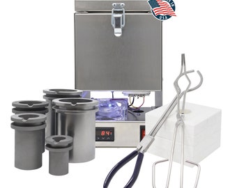 May include: A silver metal melting furnace with a digital temperature display, four graphite crucibles, a pair of metal tongs, and a stack of white firebricks. The furnace has a label that reads "Made in USA".
