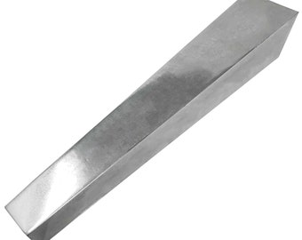 May include: A solid, silver-colored metal wedge with a rectangular base and a tapered, angled top. The wedge is designed with a smooth, reflective surface and a clean, industrial aesthetic. The object is isolated on a white background.