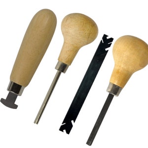 May include: Four metal tools with wooden handles. The tools have different shaped tips, including a pointed tip, a flat tip, and a tip with a serrated edge. The tools are used for crafting and jewelry making.