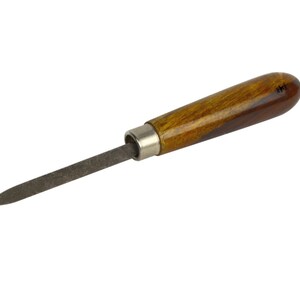 May include: A small file with a wooden handle. The handle is brown with a wood grain pattern.