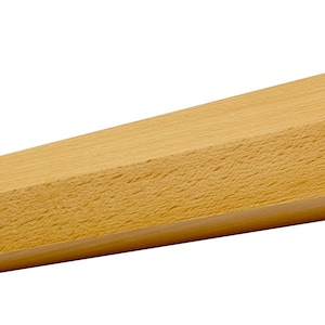 May include: A light-colored, wooden furniture leg with a trapezoidal shape. The leg is a natural wood color and has a smooth, unfinished surface. The leg is angled and tapers from a wider base to a narrower top.