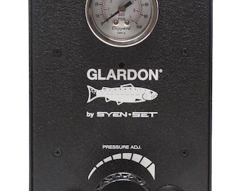 May include: Black metal device with a pressure gauge, a large adjustment knob, and a power switch. The gauge reads in BAR and PSIG. The device has the text "GLARDON" and "by SYEN SET" with a fish logo.