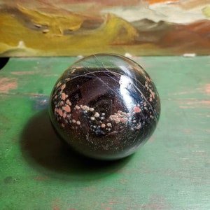 Blown art glass paper weight by master glassblower, Vernon Brejcha, dark colors