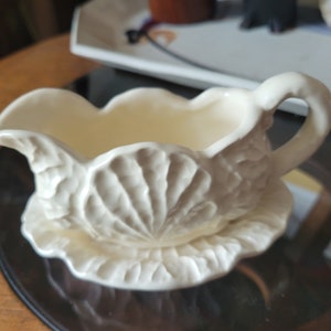 Vintage off white ruffled edge cabbage leaf small sauce boat with underplate.