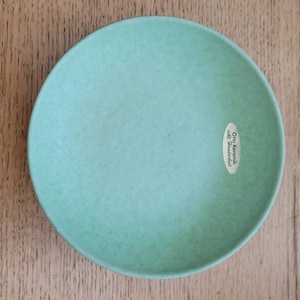 May include: A light green ceramic bowl with a small label that reads "Otto Keramik, die Handarbeit".