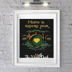 May include: A black and green cross-stitch pattern with the text "Home is where your heart is" and a green door with a yellow heart. The pattern is by The Wooly Duck.