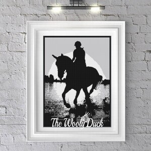 May include: Black and white silhouette of a person riding a horse in a field. The image is in a frame with the text "The Woolly Duck" at the bottom.