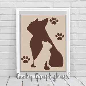 May include: A brown silhouette of a large dog and a smaller dog, with three paw prints in the background. The image is in a white frame.