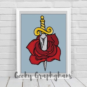 May include: A red rose with a silver dagger piercing through the center. The dagger has a gold handle with a swirl design. The background is a light blue color.