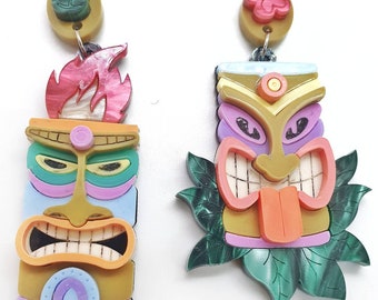 Asymmetric pendant earrings with laser cut acrylic tiki masks and colored plexiglass