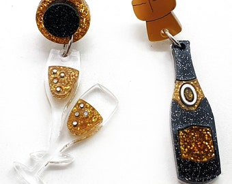 Asymmetric sparkling wine and flute acrylic and laser-carved plexiglass drop earrings