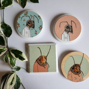 Small paintings of animals in clothing image 1