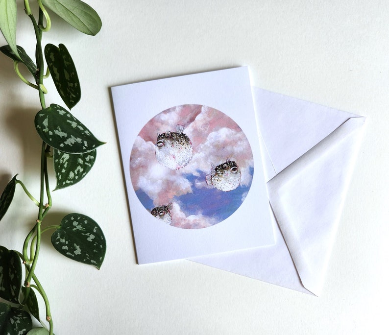 Greeting card of pufferfish in the sky image 1
