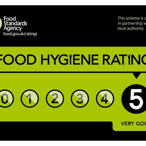 May include: A black and green Food Hygiene Rating sign. The sign features the Food Standards Agency logo and the text "FOOD HYGIENE RATING". It displays a rating of "5 VERY GOOD" with a series of numbered circles from 0 to 5.