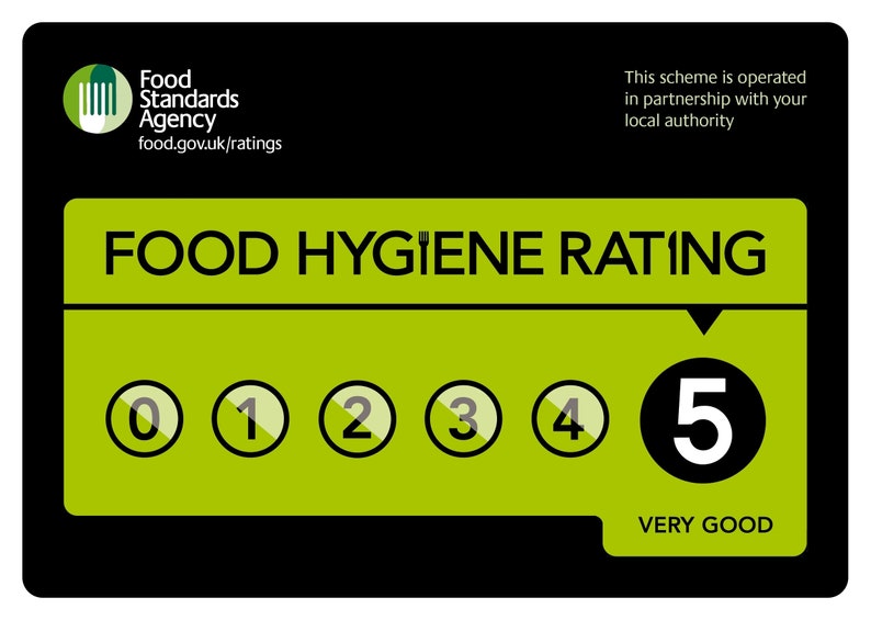 May include: A black and green Food Hygiene Rating sign. The sign features the Food Standards Agency logo and the text "FOOD HYGIENE RATING". It displays a rating of "5 VERY GOOD" with a series of numbered circles from 0 to 5.