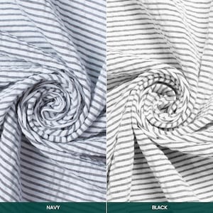 May include: Two fabrics, one navy and one black, with white horizontal stripes, are shown rolled up. The navy fabric is labelled "NAVY" and the black fabric is labelled "BLACK". The image highlights the texture and pattern of the textiles.