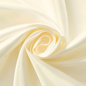 May include: Creamy white satin fabric with soft folds and wrinkles, creating a smooth and elegant texture.